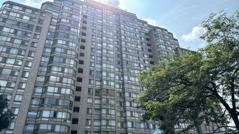 Precast condo tower facade with rows of aluminum windows and balconies, site of a Toronto building envelope project
